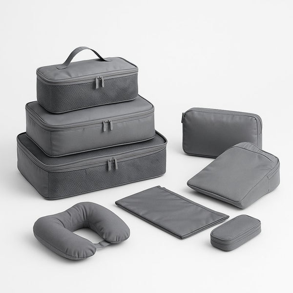 Set of gray travel packing cubes and accessories on a white background
A 6-piece compression packing cube set designed to maximize suitcase space and keep clothes organized. Perfect for travel, business trips, or vacations. Lightweight and durable.